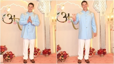 John Cena strikes a pose at the wedding ceremony in a light blue bandhagala kurta and white pants. He styled the look with tan brown dress shoes, (HT Photo/Varinder Chawla) John Cena strikes a pose at the wedding ceremony in a light blue bandhagala kurta and white pants. He styled the look with tan brown dress shoes, (HT Photo/Varinder Chawla)