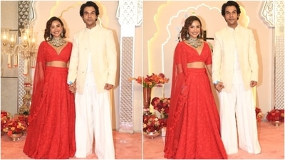 Patralekhaa and Rajkummar Rao looked stunning as they posed for the paparazzi at Anant Ambani and Radhika Merchant's wedding. While Patralekhaa wore a red embellished lehenga set, Raj complemented his wife in a cream kurta, flared pants, and embroidered sherwani jacket. (HT Photo/Varinder Chawla) Patralekhaa and Rajkummar Rao looked stunning as they posed for the paparazzi at Anant Ambani and Radhika Merchant's wedding. While Patralekhaa wore a red embellished lehenga set, Raj complemented his wife in a cream kurta, flared pants, and embroidered sherwani jacket. (HT Photo/Varinder Chawla)