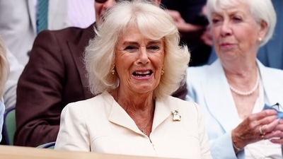 Gracing the event with her presence, Queen Camilla took her seat in the Royal Box in white, greeting the crowd with a wave. (The Associated Press) Gracing the event with her presence, Queen Camilla took her seat in the Royal Box in white, greeting the crowd with a wave. (The Associated Press)