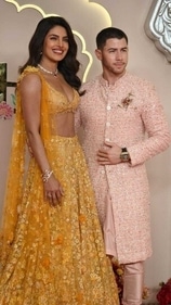 Priyanka Chopra and Nick Jonas posed for pictures at Anant Ambani-Radhika Merchant's wedding venue. (HT photos)