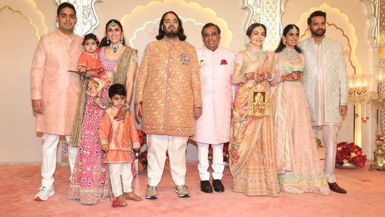Anant Ambani and the rest of the Ambani family posed for the media at the wedding venue. 