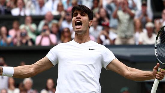 Carlos Alcaraz celebrates winning against Daniil Medvedev during their men's singles semi-final, in Wimbledon on Friday. (AFP)