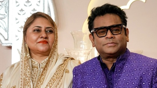 Bollywood music composer and singer AR Rahman poses for a photograph with his wife Saira Banu as they arrive at the wedding. (AP Photo /Rajanish Kakade)(AP)