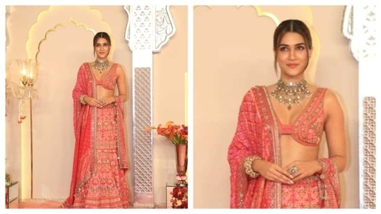Kriti Sanon brought some serious Barbie energy to the Ambani wedding. She donned a pink lehenga, with a statement silver choker piece. Nuanced embroidery work was seen on her lehenga skirt. (HT Photo/Varinder Chawla )