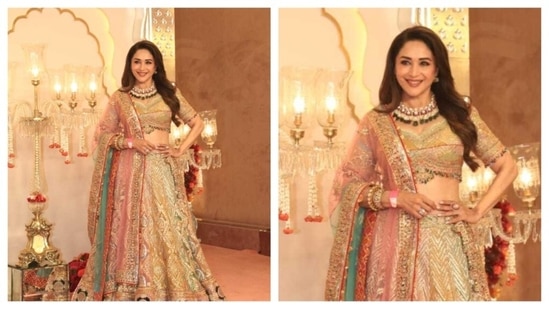 Madhuri Dixit dazzled with her evergreen beauty as she wore a pastel lehenga. Her golden lehenga was paired with a blue-pink dupatta. With a statement multi-coloured necklace, she completed her look. (HT Photo/Varinder Chawla )