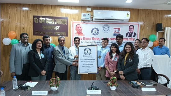 Pratapgarh DM Sanjeev Ranjan receiving the Elite World Record certification. (Sourced)