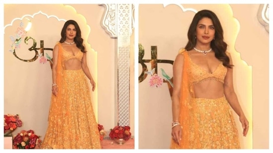 Priyanka Chopra, a.k.a, the desi girl looked gorgeous in this orange lehenga with a simple necklace. Exuding desi princess vibe, her lehenga skirt was adorned with beautiful floral print. (HT Photo/Varinder Chawla )