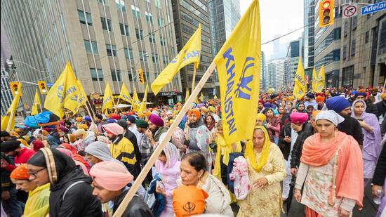 Sikhs march in a parade to mark Khalsa Day celebrations in Toronto, Ontario, Canada on April 28. (AFP)