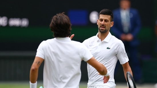 Serbia's Novak Djokovic shakes hands with Italy's Lorenzo Musetti after winning their semi final match(REUTERS)