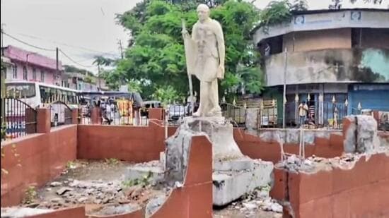 The statue of Mahatma Gandhi in Assam’s Doomdooma town before being removed using an excavator crane on Wednesday. (Sourced image)