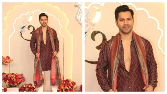 Varun Dhawan's boyish charm was off charts as he rocked a maroon kurta with silver thread work. He carried a shawl around his neck, completing his look. (HT Photo/Varinder Chawla )