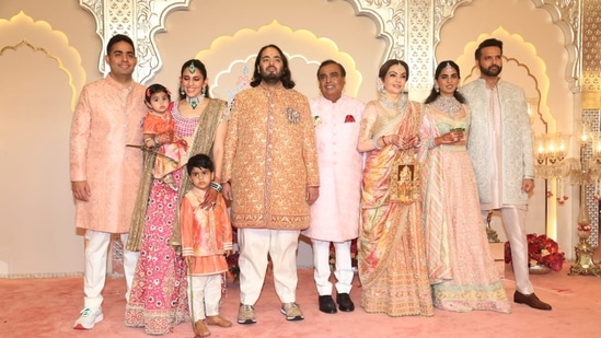Mukesh Ambani, Akash Ambani, Shloka Ambani, Anand Piramal and Isha Ambani decked up in pastel outfits.