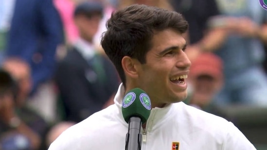 Carlos Alcaraz reacts after being booed by Wimbledon crowd