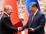 Chinese President Xi Jinping, right, and Russian President Vladimir Putin exchange documents after a signing ceremony during their meeting in Beijing, China. (AP) Chinese President Xi Jinping, right, and Russian President Vladimir Putin exchange documents after a signing ceremony during their meeting in Beijing, China. (AP)