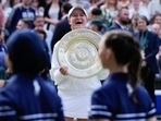 Barbora Krejcikova of the Czech Republic reacts as she holds her trophy after defeating Jasmine Paolini of Italy in the women's singles final(AP) Barbora Krejcikova of the Czech Republic reacts as she holds her trophy after defeating Jasmine Paolini of Italy in the women's singles final(AP)