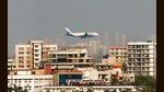 Mumbai, India - Dec. 4, 2019: A plane landing close to high rise buildings near to Juhu in Mumbai, India, on Wednesday, December 4, 2019. (Photo by Satyabrata Tripathy/Hindustan Times) (Satyabrata Tripathy/HT Photo) Mumbai, India - Dec. 4, 2019: A plane landing close to high rise buildings near to Juhu in Mumbai, India, on Wednesday, December 4, 2019. (Photo by Satyabrata Tripathy/Hindustan Times) (Satyabrata Tripathy/HT Photo)