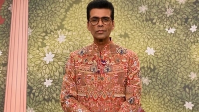 Bollywood's ace director and fashion lover Karan Johar reached the venue looking dapper in an embroidered red sherwani with multi-colour prints and pulled the attire off like only he could. (HT Photo) Bollywood's ace director and fashion lover Karan Johar reached the venue looking dapper in an embroidered red sherwani with multi-colour prints and pulled the attire off like only he could. (HT Photo)