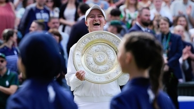 Barbora Krejcikova of the Czech Republic reacts as she holds her trophy after defeating Jasmine Paolini of Italy in the women's singles final (AP) Barbora Krejcikova of the Czech Republic reacts as she holds her trophy after defeating Jasmine Paolini of Italy in the women's singles final (AP)