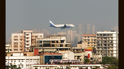Mumbai, India - Dec. 4, 2019: A plane landing close to high rise buildings near to Juhu in Mumbai, India, on Wednesday, December 4, 2019. (Photo by Satyabrata Tripathy/Hindustan Times) (Satyabrata Tripathy/HT Photo) Mumbai, India - Dec. 4, 2019: A plane landing close to high rise buildings near to Juhu in Mumbai, India, on Wednesday, December 4, 2019. (Photo by Satyabrata Tripathy/Hindustan Times) (Satyabrata Tripathy/HT Photo)