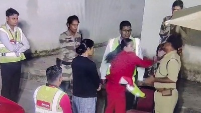A grab from a CCTV footage shows a SpiceJet staff member slapping a Central Industrial Security Force (CISF) jawan during an argument. (PTI) A grab from a CCTV footage shows a SpiceJet staff member slapping a Central Industrial Security Force (CISF) jawan during an argument. (PTI)
