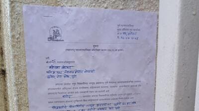 The notice states that as per the complaint received, there is an encroachment of public road in front of a residence located in plot number 112, National Housing Society on Baner Road in Aundh. (HT PHOTO)