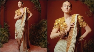 Gigi Hadid also wore a similar style as Janhvi Kapoor when she attended the NMACC Gala in April. The model wore an absolutely divine Kamasutra-inspired cropped sleeve jacket blouse adorned with South Indian temple jewellery for the occasion. She paired the exquisite piece with a chikankari saree. (Instagram) Gigi Hadid also wore a similar style as Janhvi Kapoor when she attended the NMACC Gala in April. The model wore an absolutely divine Kamasutra-inspired cropped sleeve jacket blouse adorned with South Indian temple jewellery for the occasion. She paired the exquisite piece with a chikankari saree. (Instagram)