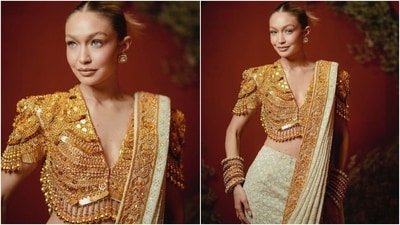 Abu Jani Sandeep Khosla designed Gigi's look for the event. They adorned the South Indian temple jewellery blouse with bold tassels on the border. Meanwhile, the chikankari saree consists of a slim-fit skirt and a floor-grazing drape, hand-embroidered by female artisans at Abu Jani Sandeep Khosla atelier in Lucknow, Uttar Pradesh. Lastly, crystals, sequin highlights, and gold zardozi borders add to the saree's beauty. (Instagram) Abu Jani Sandeep Khosla designed Gigi's look for the event. They adorned the South Indian temple jewellery blouse with bold tassels on the border. Meanwhile, the chikankari saree consists of a slim-fit skirt and a floor-grazing drape, hand-embroidered by female artisans at Abu Jani Sandeep Khosla atelier in Lucknow, Uttar Pradesh. Lastly, crystals, sequin highlights, and gold zardozi borders add to the saree's beauty. (Instagram)