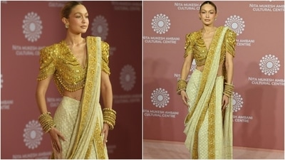 Gigi paired the saree and the statement temple jewellery blouse with ornate gold stacked kadhas, diamond-cut earrings, and embellished pumps. Lastly, a centre-parted sleek bun, winged eyeliner, nude lip shade, mascara-adorned lashes, rouge-tinted cheeks, and feathered brows completed the glam. (Instagram) Gigi paired the saree and the statement temple jewellery blouse with ornate gold stacked kadhas, diamond-cut earrings, and embellished pumps. Lastly, a centre-parted sleek bun, winged eyeliner, nude lip shade, mascara-adorned lashes, rouge-tinted cheeks, and feathered brows completed the glam. (Instagram)