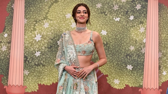 Ananya Pandey attending the blessings ceremony in a teal lehenga.