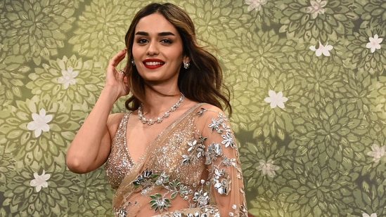 Manushi Chhillar attending the blessings ceremony in a net saree with gota work.