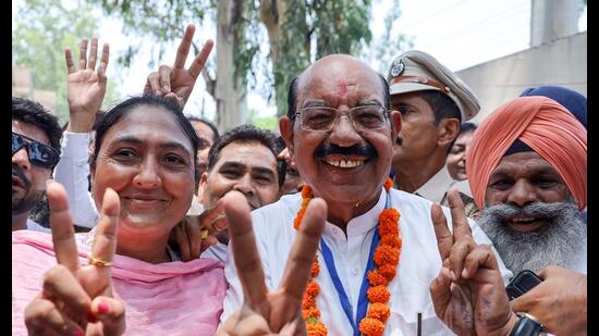 AAP candidate Mohinder Bhagat, along with party members, celebrates his bypoll victory in Jalandhar on Saturday. (ANI)