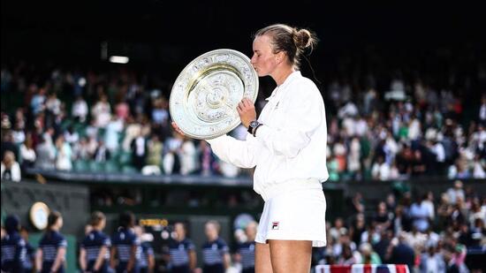 Barbora Krejcikova kisses the winner’s trophy in London on Saturday. (AFP)