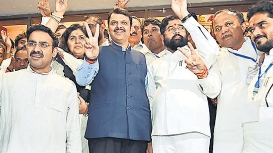 CM Eknath Shinde and Dy CM Devendra Fadnavis flash the victory sign with winning candidates of Mahayuti, after winning the MLC election during the monsoon session at Vidhan Bhavan in Mumbai on Friday, July 12, 2024. (Photo by Anshuman Poyrekar/ Hindustan Times) (Hindustan Times)