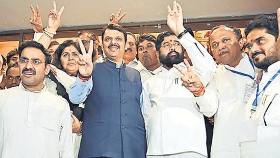 CM Eknath Shinde and Dy CM Devendra Fadnavis flash the victory sign with winning candidates of Mahayuti, after winning the MLC election during the monsoon session at Vidhan Bhavan in Mumbai on Friday, July 12, 2024. (Photo by Anshuman Poyrekar/ Hindustan Times) (Hindustan Times)