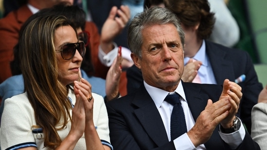 Hugh Grant enjoyed a day date at the championship with his wife Anna Elisabet Eberstein.(AFP)