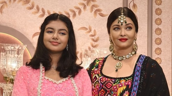 Aaradhya Bachchan and Aishwarya Rai at the wedding. Aaradhya wore a pink suit and Aishwarya chose a colourful number for the event,
