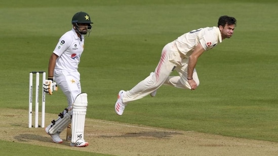 England's James Anderson, right, bowls a delivery past Pakistan's Babar Azam(AP)