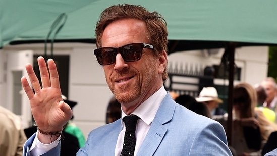 Damian Lewis looked smart in a pale blue suit and dark sunglasses.