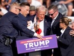 Republican presidential candidate former President Donald Trump is helped off the stage at a campaign event in Butler, Pa., on Saturday, July 13, 2024. AP/PTI(AP07_14_2024_000022A)