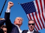 Republican presidential candidate and former U.S. President Donald Trump gestures with a bloodied face while he is assisted by U.S. Secret Service personnel after he was shot in the right ear during a campaign rally at the Butler Farm Show in Butler, Pennsylvania. (AP) Republican presidential candidate and former U.S. President Donald Trump gestures with a bloodied face while he is assisted by U.S. Secret Service personnel after he was shot in the right ear during a campaign rally at the Butler Farm Show in Butler, Pennsylvania. (AP)