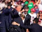Republican presidential candidate former President Donald Trump is helped off the stage at a campaign event in Butler. Republican presidential candidate former President Donald Trump is helped off the stage at a campaign event in Butler.