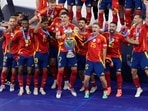 Spain's Alvaro Morata lifts the trophy after winning the final match against England at the Euro 2024 soccer tournament in Berlin, Germany(AP) Spain's Alvaro Morata lifts the trophy after winning the final match against England at the Euro 2024 soccer tournament in Berlin, Germany(AP)