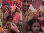 The image shows Ziva Dhoni with MS Dhoni at Ambani wedding. (Screengrab) The image shows Ziva Dhoni with MS Dhoni at Ambani wedding. (Screengrab)