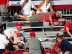 TOPSHOT - Trump supporters are seen covered with blood in the stands after guns were fired atDonald Trump at a campaign event in Butler, Pennsylvania, July 13, 2024. (Photo by Rebecca DROKE / AFP)