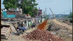 Railway officials say the encroachments along the road have caused disruptions in track-widening work from Ludhiana to Kila Raipur and the deadline has been missed. (Gurpreet Singh/HT) Railway officials say the encroachments along the road have caused disruptions in track-widening work from Ludhiana to Kila Raipur and the deadline has been missed. (Gurpreet Singh/HT)