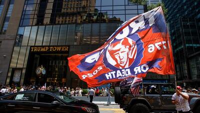 A man carries a flag in support of Republican presidential candidate and former U.S. President Donald Trump, after Trump was injured when shots were fired during a campaign rally held in Butler, Pennsylvania, outside Trump Tower in New York. (REUTERS) A man carries a flag in support of Republican presidential candidate and former U.S. President Donald Trump, after Trump was injured when shots were fired during a campaign rally held in Butler, Pennsylvania, outside Trump Tower in New York. (REUTERS)