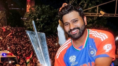India's captain Rohit Sharma shows T20 World Cup trophy to a huge crowd of fans during the victory parade, in Mumbai (ICC - X ) India's captain Rohit Sharma shows T20 World Cup trophy to a huge crowd of fans during the victory parade, in Mumbai (ICC - X )