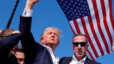 Republican presidential candidate and former U.S. President Donald Trump gestures with a bloodied face while he is assisted by U.S. Secret Service personnel after he was shot in the right ear during a campaign rally at the Butler Farm Show in Butler, Pennsylvania. (AP) Republican presidential candidate and former U.S. President Donald Trump gestures with a bloodied face while he is assisted by U.S. Secret Service personnel after he was shot in the right ear during a campaign rally at the Butler Farm Show in Butler, Pennsylvania. (AP)