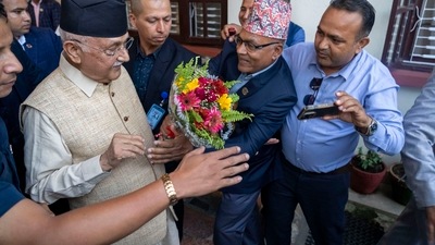 Khadga Prasad Oli, left, the chairman of the Communist Party of Nepal leaves his residence to meet his supporters after being appointed as Prime Minister, in Kathmandu, Nepal, Sunday, July 14, 2024. AP/PTI (AP) Khadga Prasad Oli, left, the chairman of the Communist Party of Nepal leaves his residence to meet his supporters after being appointed as Prime Minister, in Kathmandu, Nepal, Sunday, July 14, 2024. AP/PTI (AP)