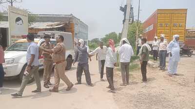 Followers of Bhole Baba outside the ashram being turned back. (HT)